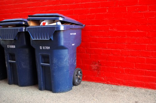 Construction site with builders managing waste clearance